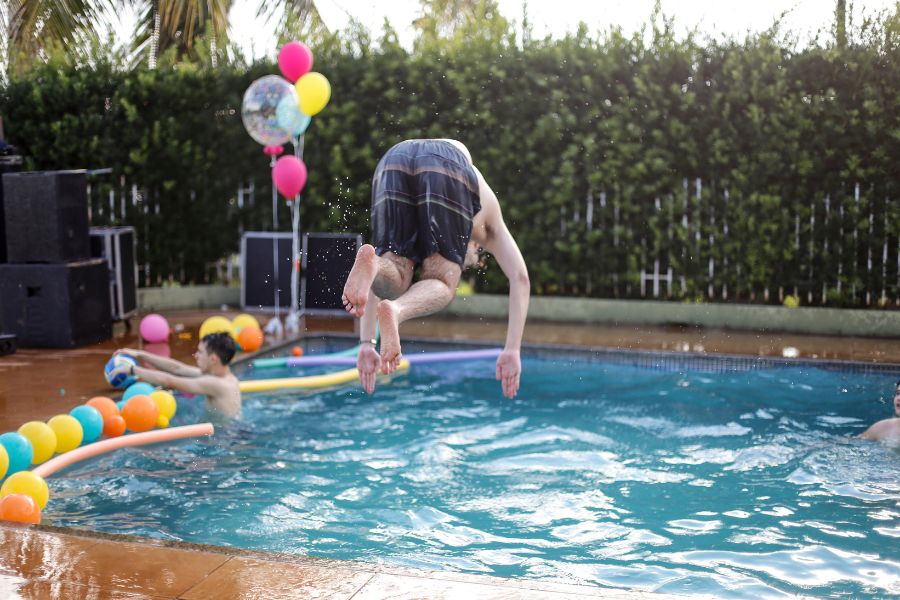 family enjoy swimming pool